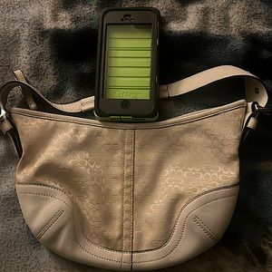 It’s a coach brand handbag and an otterbox iPhone 5 case,